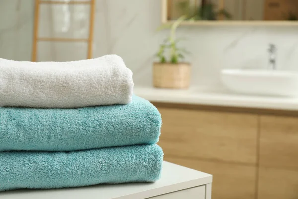 Stack Of Clean Towels On Bathroom Countertop. Space For Text Stock Photo,  Picture and Royalty Free Image. Image 196775238.