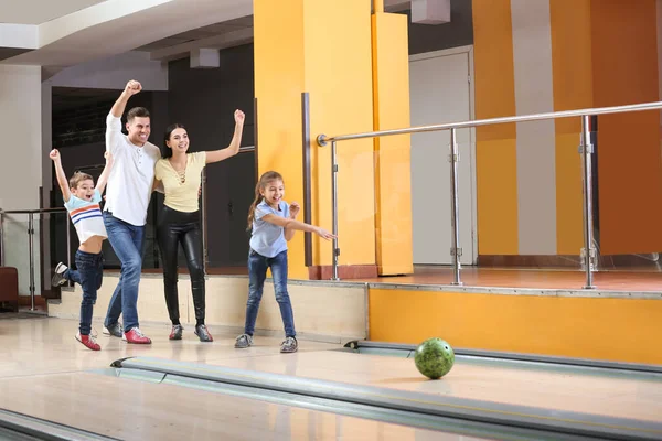 Happy family spending time together in bowling club Royalty Free Stock Photos