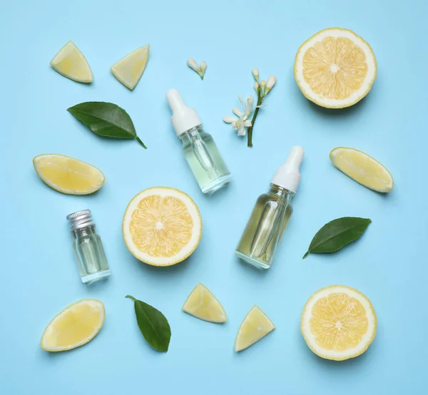 Flat Lay Composition Bottles Citrus Essential Oil Light Blue Background — ストック写真