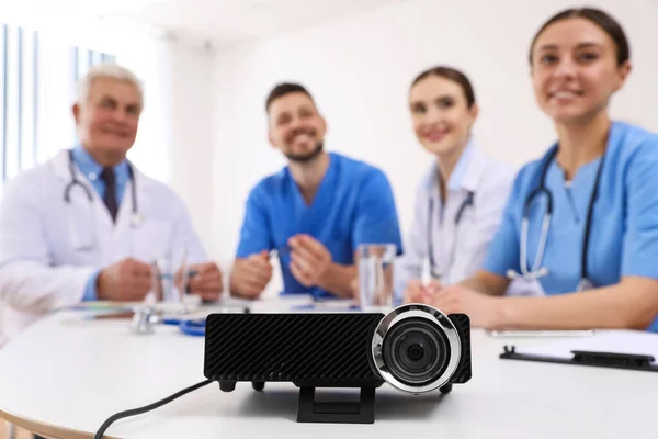 Video projector on table during medical conference