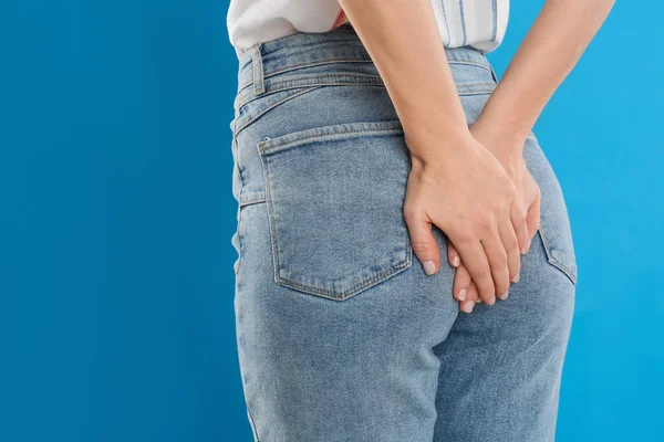 Woman Suffering Hemorrhoid Light Blue Background Closeup — Stock Photo, Image