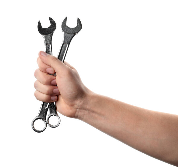 Auto mechanic holding wrenches isolated on white, closeup