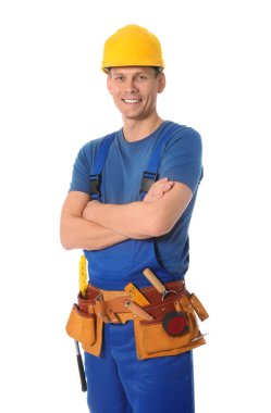 Handsome carpenter with tool belt isolated on white
