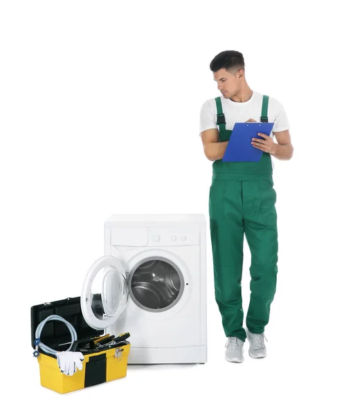 Repairman with clipboard and toolbox near washing machine on whi — 스톡 사진