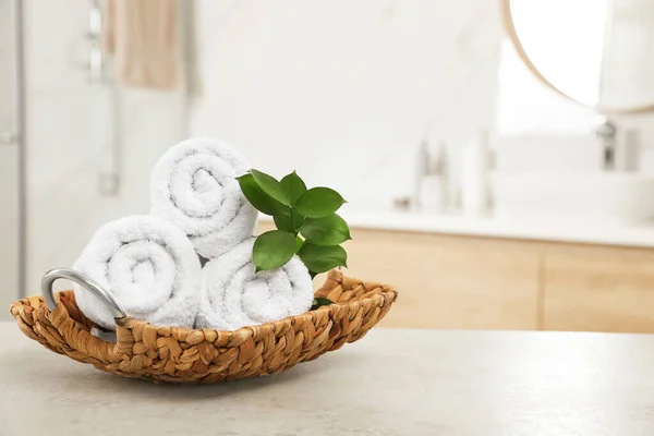 Rolled Fresh Towels Green Leaves Grey Table Bathroom Space Text — Stock Photo, Image