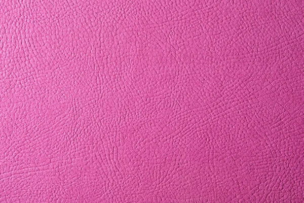 Texture of pink leather as background, closeup
