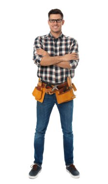 Handsome carpenter with tool belt isolated on white
