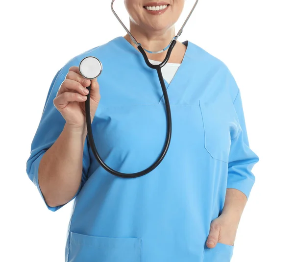 Mature doctor with stethoscope on white background, closeup — Stock Photo, Image