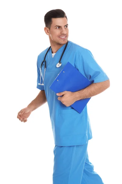 Doctor with clipboard walking on white background — Stock Photo, Image