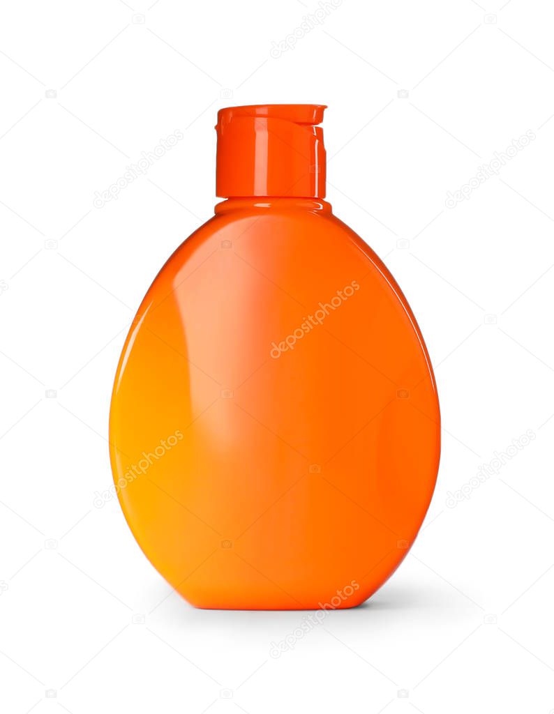 Orange plastic bottle isolated on white. Mockup for design