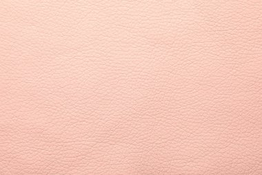 Arka plan olarak açık pembe deri dokusu, yakın plan