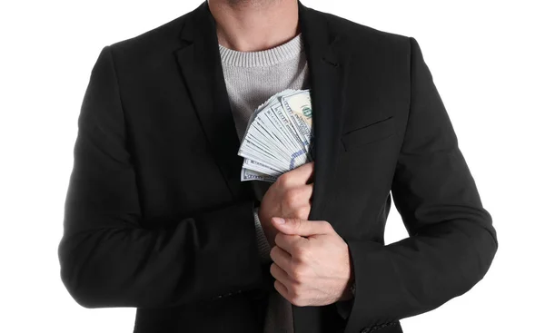 Man putting bribe money into pocket on white background, closeup — Stock Photo, Image