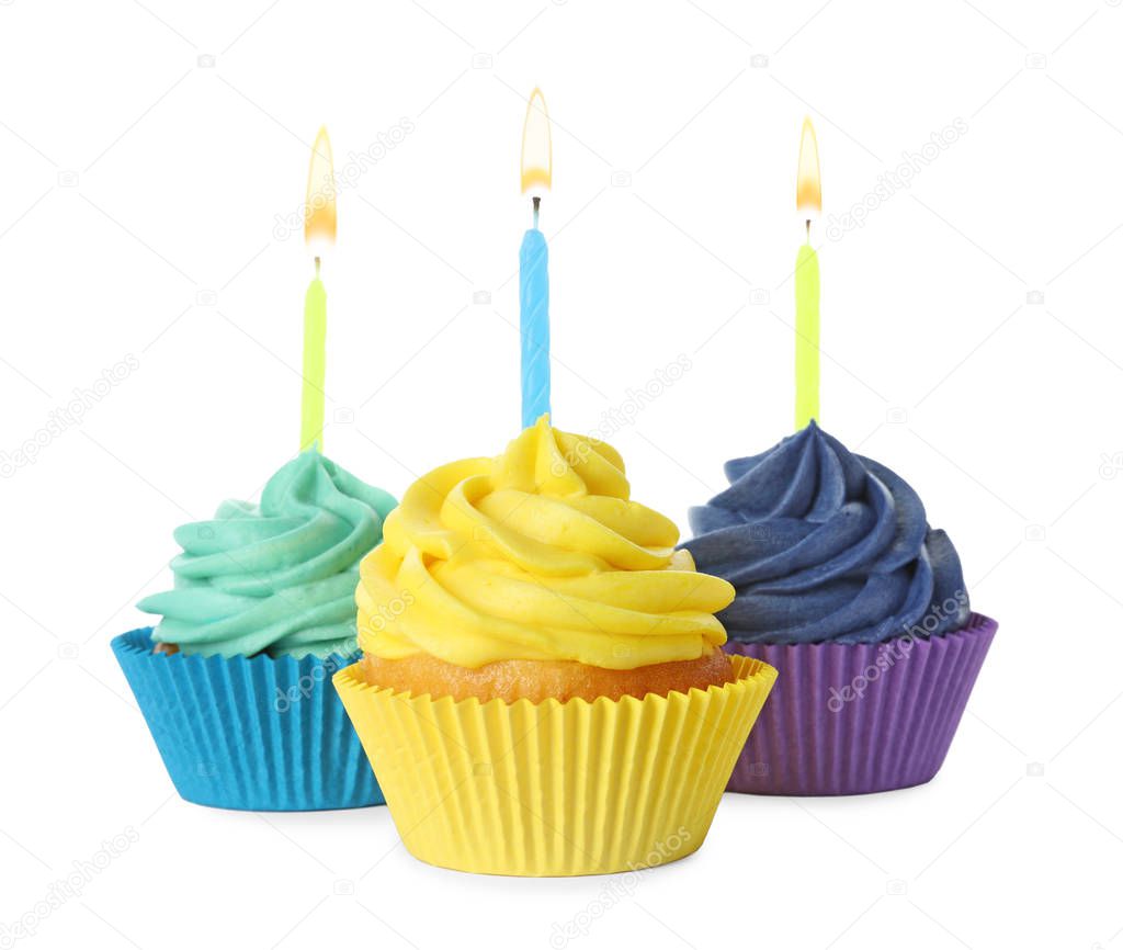 Delicious birthday cupcakes with candles isolated on white