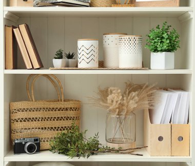 White shelving unit with different decorative elements
