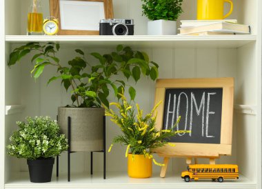 White shelving unit with different decorative elements