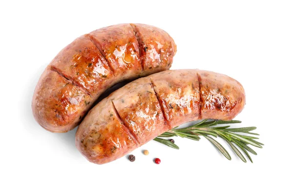 Grilled sausages and rosemary on white background, top view — 스톡 사진