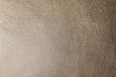 Arka plan olarak açık kahverengi deri dokusu, yakın plan