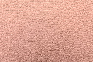 Arka plan olarak açık pembe deri dokusu, yakın plan