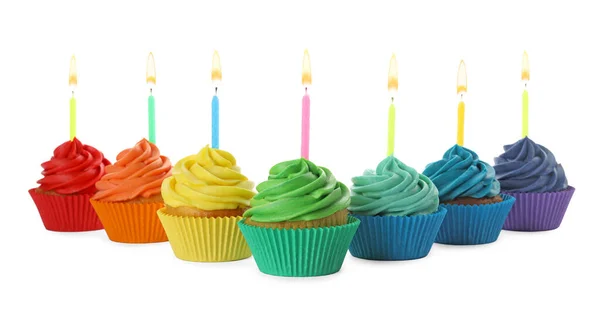 Delicious birthday cupcakes with candles isolated on white — Stock Photo, Image