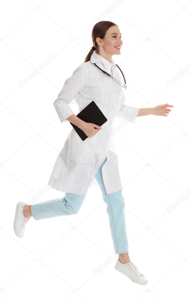 Doctor with clipboard running on white background