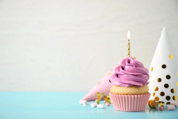 Delicioso Cupcake Cumpleaños Con Vela Encendida Mesa Madera Azul Claro —  Fotos de Stock