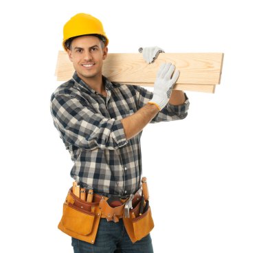 Handsome carpenter with wooden planks isolated on white