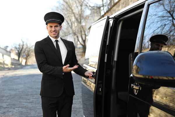 Driver opening door of luxury car. Chauffeur service