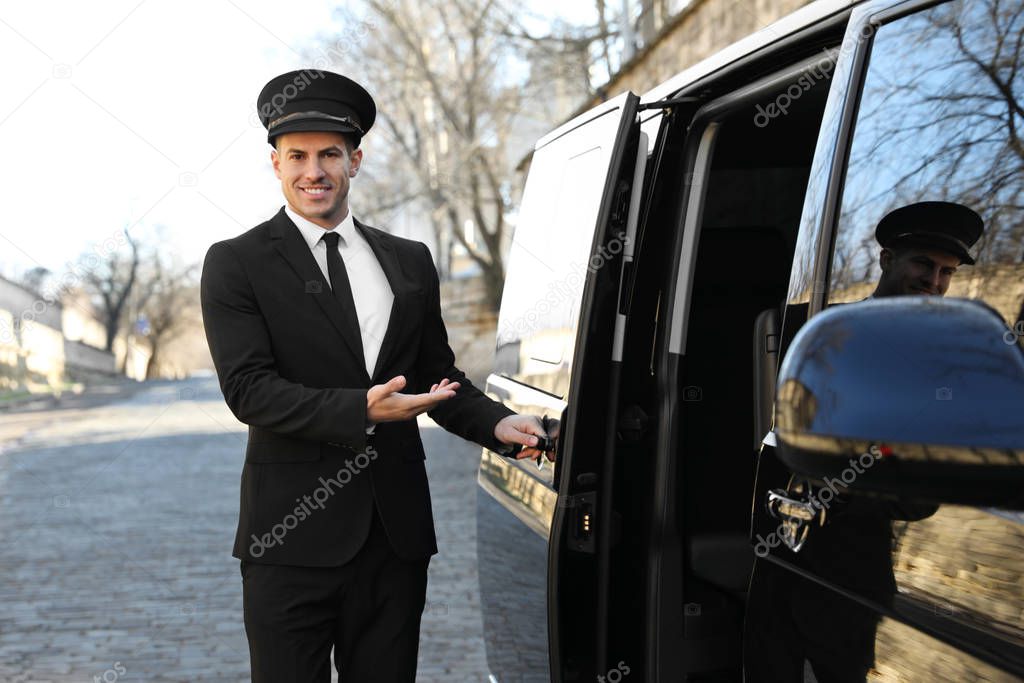 Driver opening door of luxury car. Chauffeur service
