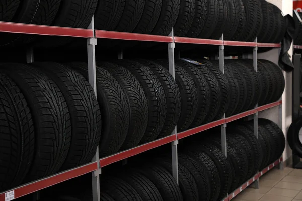 Car tires on rack in auto store