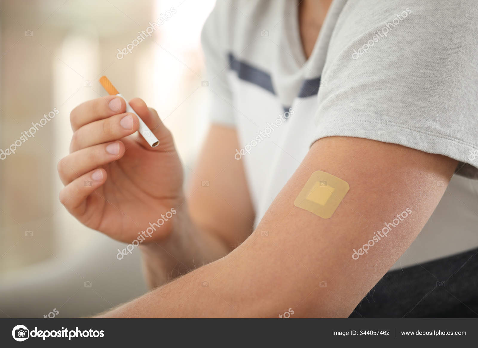 https://st3.depositphotos.com/16122460/34405/i/1600/depositphotos_344057462-stock-photo-man-nicotine-patch-cigarette-closeup.jpg