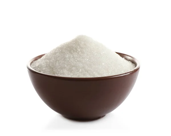 Azúcar granulado en tazón aislado sobre blanco —  Fotos de Stock