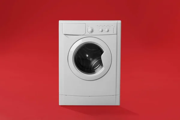 Modern washing machine on red background. Laundry day — Stock Photo, Image