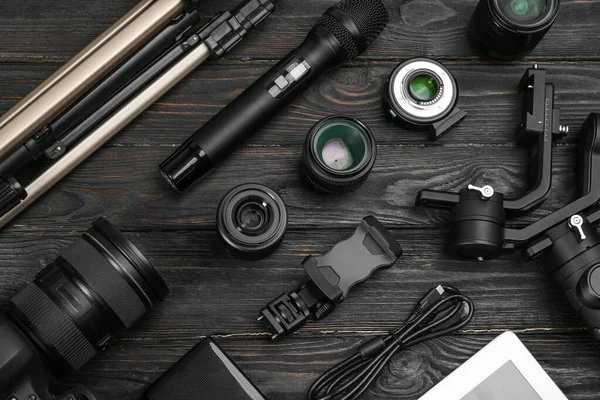 Flat lay composition with camera and video production equipment — Stockfoto