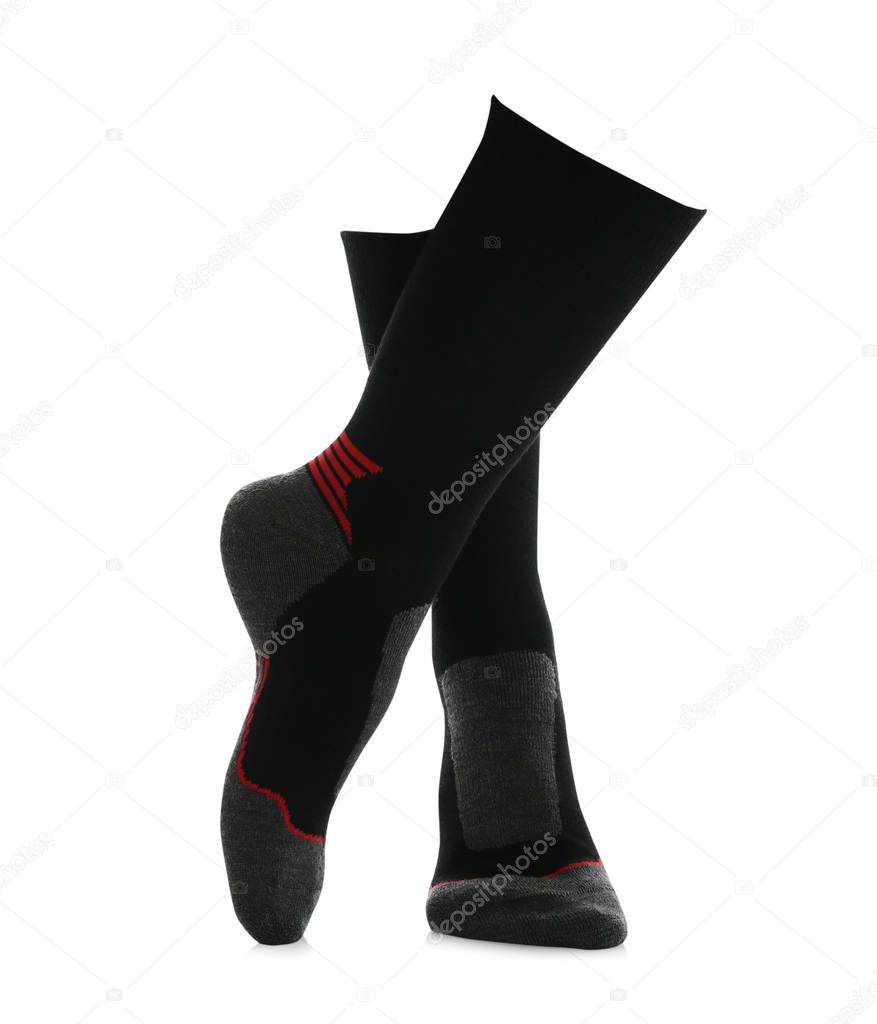 Woman wearing thermal socks on white background, closeup of legs