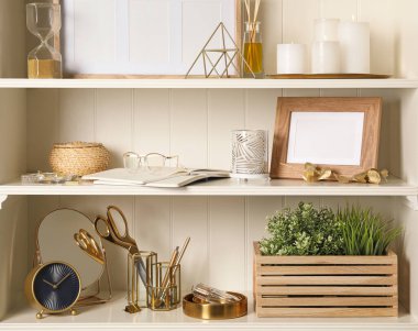White shelving unit with different decorative elements