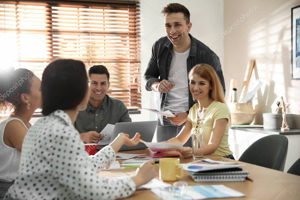 Team of professional designers working in office