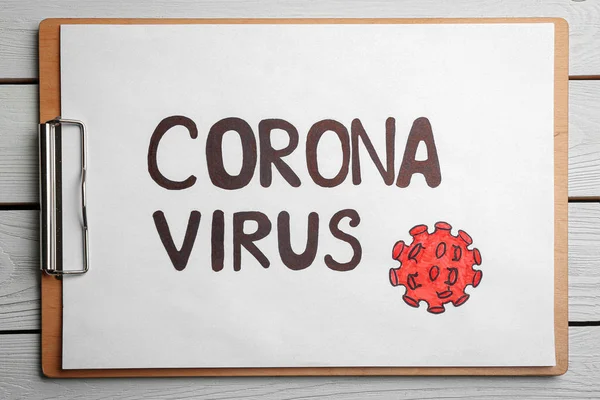 Urklipp Med Ord Corona Virus Vit Trä Bakgrund Ovanifrån — Stockfoto