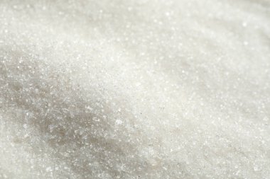 Arkaplan olarak granüle şeker yığını, yakın plan