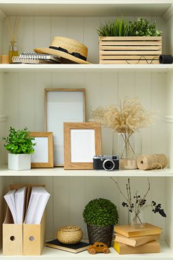 White shelving unit with different decorative elements