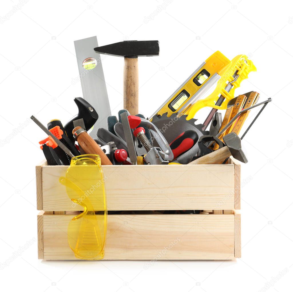 Wooden crate with different carpenter's tools isolated on white