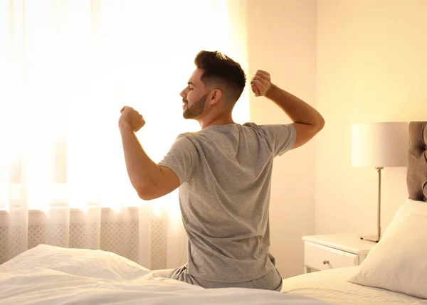 Young Man Stretching Bed Home Lazy Morning — 스톡 사진