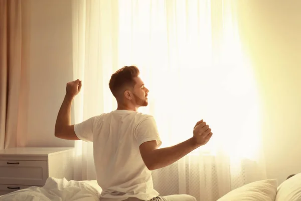 Young Man Stretching Bed Home View Back Lazy Morning — 스톡 사진