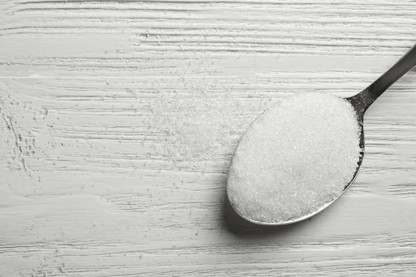Beyaz Ahşap Masada Bir Kaşık Şeker Üst Manzara Metin Için — Stok fotoğraf