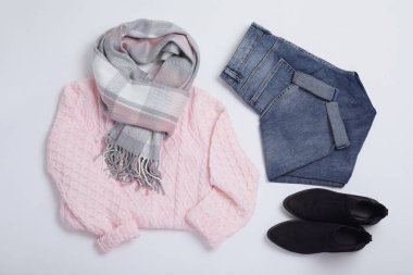 Stylish outfit with jeans on white background, top view