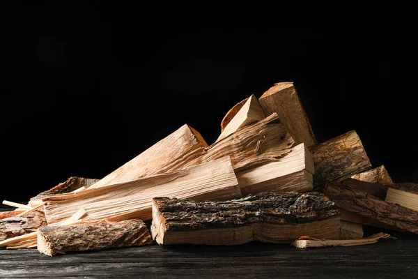 Cut Firewood Table Black Background — Stock Photo, Image