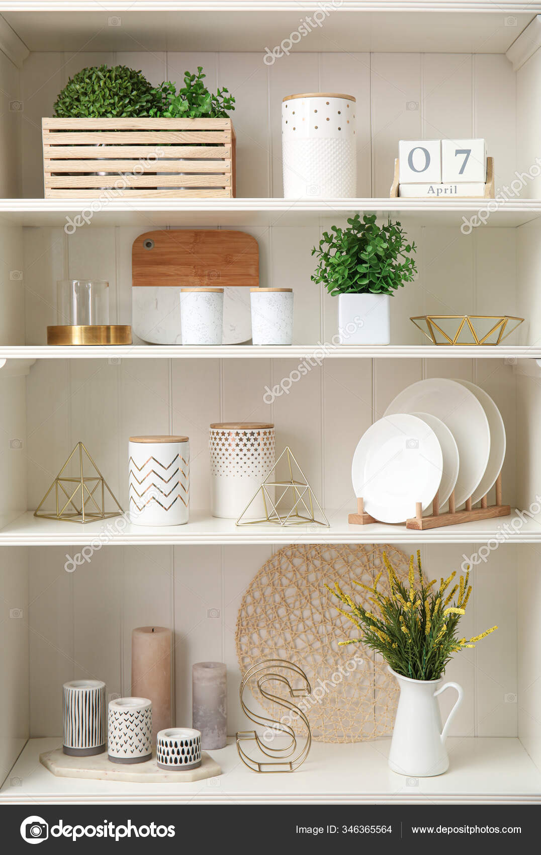 White Shelving Unit Dishes Different Decorative Stuff Stock Photo by