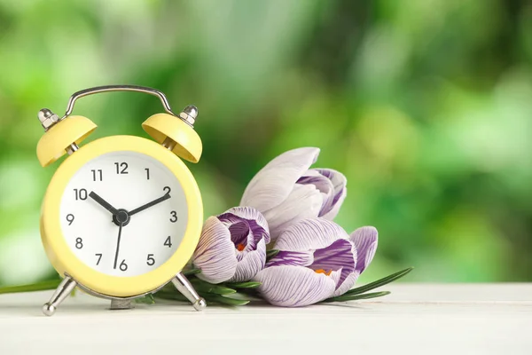 Alarm Clock Beautiful Spring Flowers White Wooden Table Time Change — Stock Photo, Image