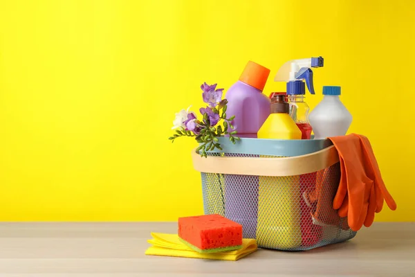 Plastic Basket Spring Flowers Cleaning Supplies Wooden Table Space Text — Stock Photo, Image