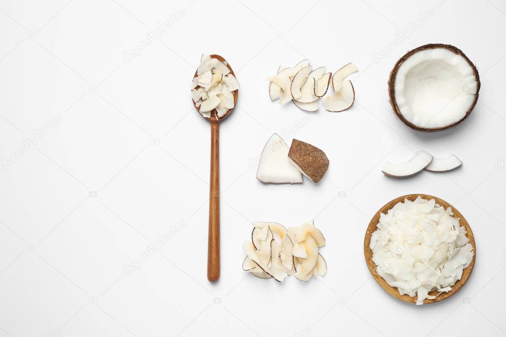 Composition with tasty coconut chips on white background, top view