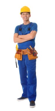 Handsome carpenter with tool belt isolated on white